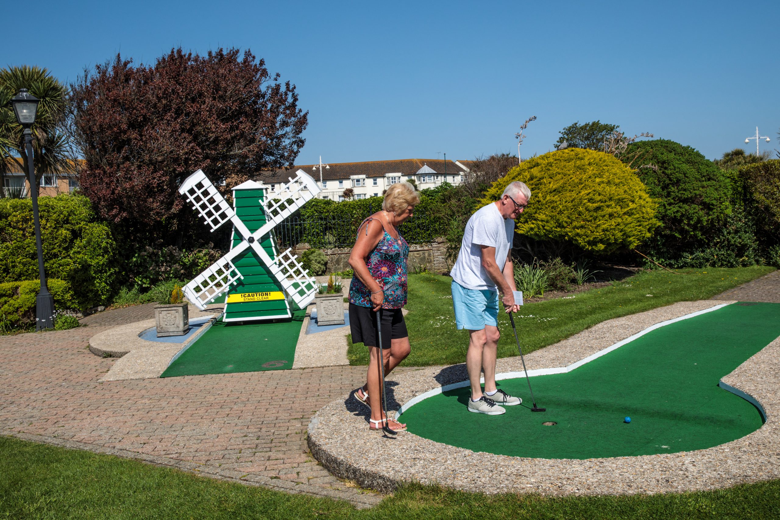 A couple play a game of crazy golf