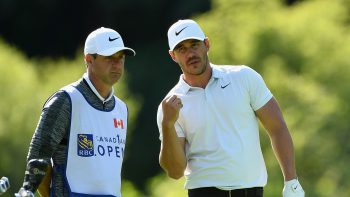 Brooks Koepka and caddie