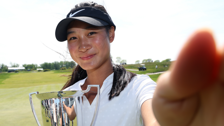 JERSEY CITY, NEW JERSEY - MAY 11: Low amateur Aphrodite Deng of Canada imitates taking a selfie after the Mizuho Americas Open 2025 at Liberty National Golf Club on May 11, 2025 in Jersey City, New Jersey. (Photo by Sarah Stier/Getty Images)